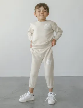 Our World Needs Jesus Beige Kids Sweatpant